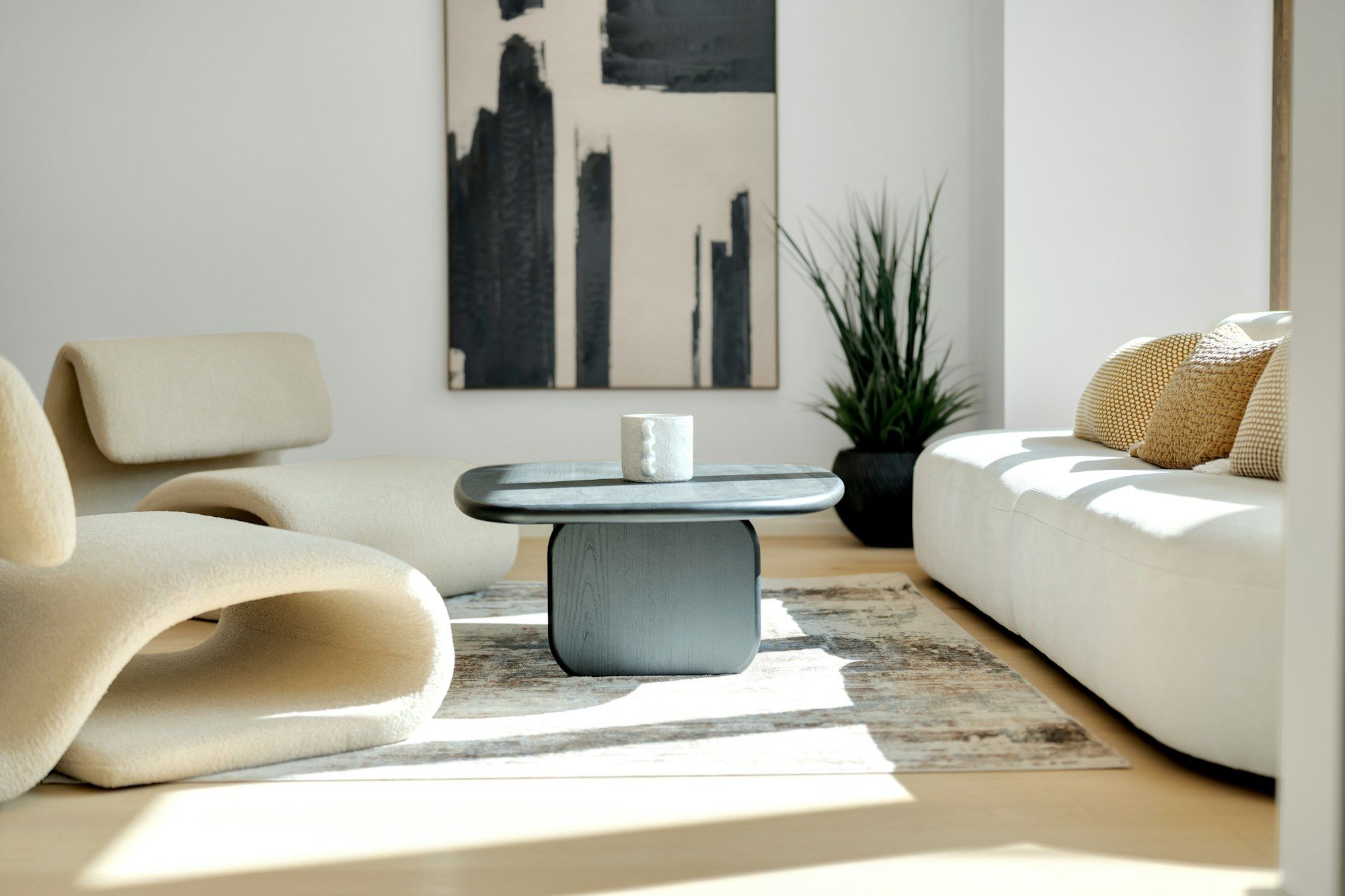 Lounge with sculptural armchairs in afternoon sun